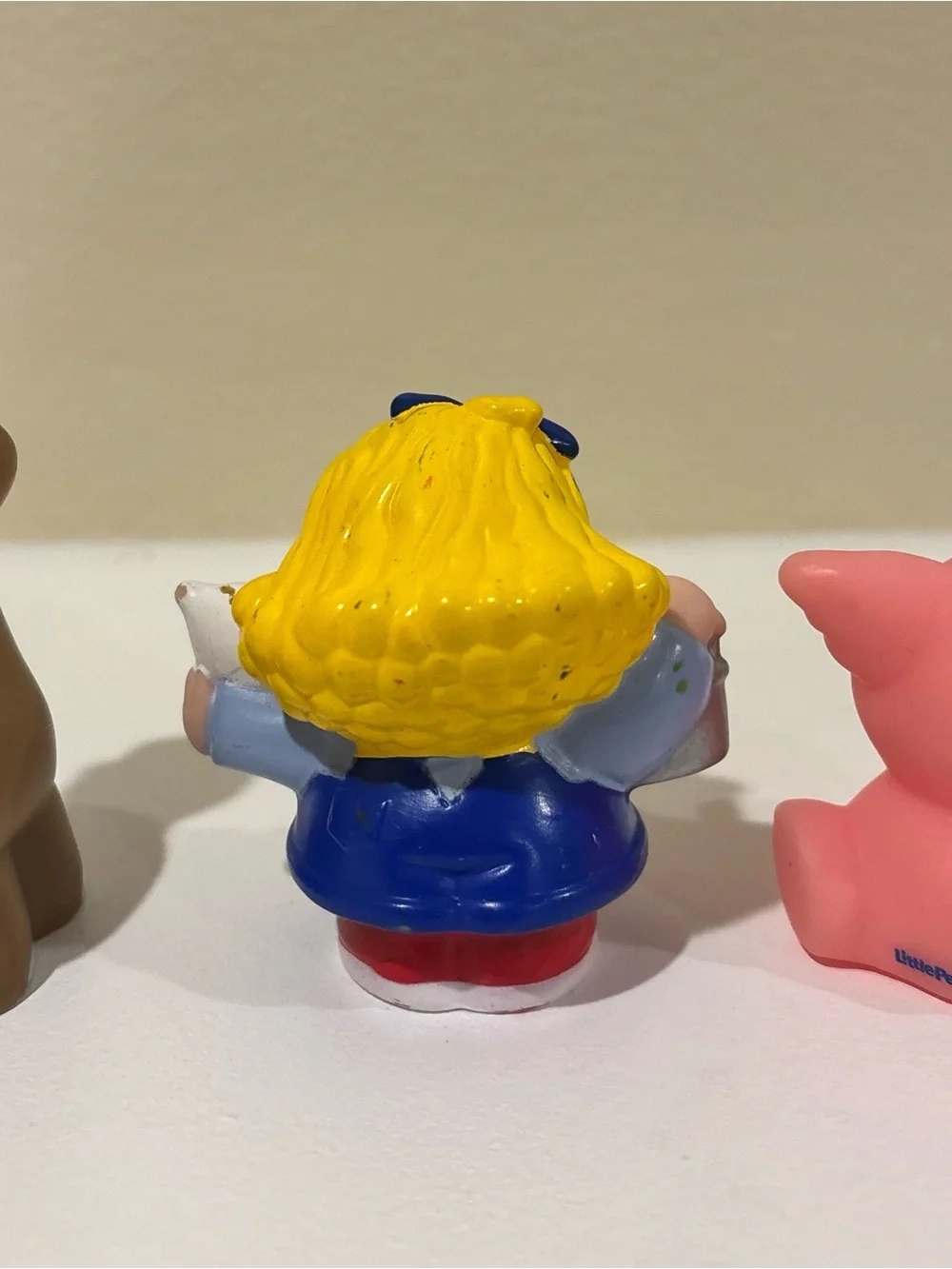 Fisher-Price Blue and Yellow Girl Figurine with Red Scarf